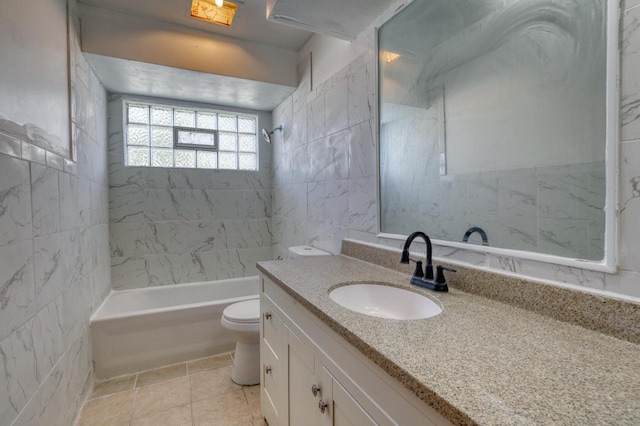 bathroom with tile walls, washtub / shower combination, toilet, and vanity