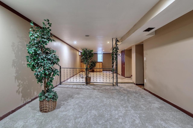 carpeted empty room featuring baseboards and recessed lighting