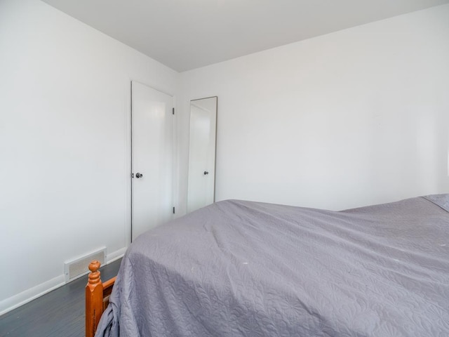 512 Conrad Ln, Beaver Dam, WI 53916 - bedroom featuring wood finished floors and baseboards