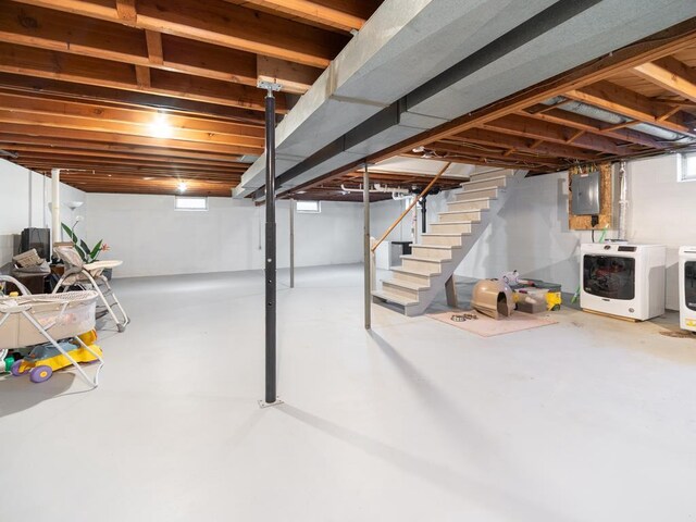 512 Conrad Ln, Beaver Dam, WI 53916 - basement featuring separate washer and dryer, stairway, and electric panel