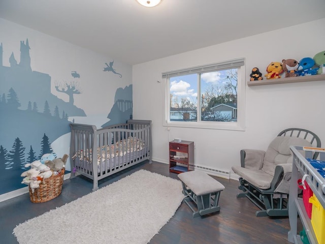 512 Conrad Ln, Beaver Dam, WI 53916 - bedroom featuring wood finished floors, baseboards, and a baseboard radiator