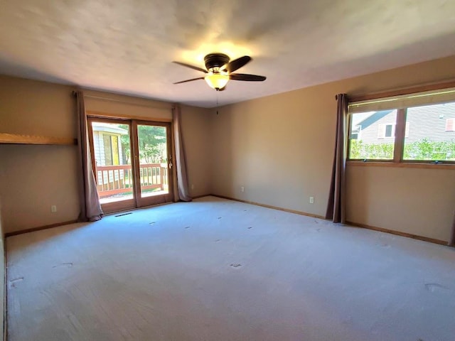 171 8th St, Clintonville, WI 54929 - spare room with ceiling fan, baseboards, and light carpet