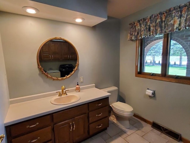 171 8th St, Clintonville, WI 54929 - bathroom with toilet, tile patterned flooring, vanity, and baseboards