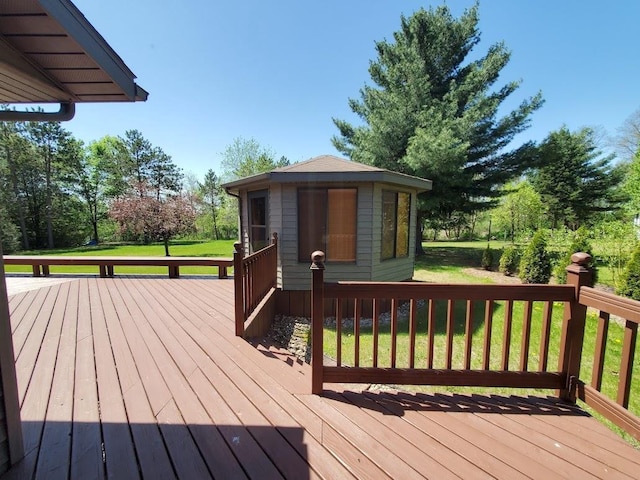 171 8th St, Clintonville, WI 54929 - deck with an outbuilding, a yard, and view of wooded area