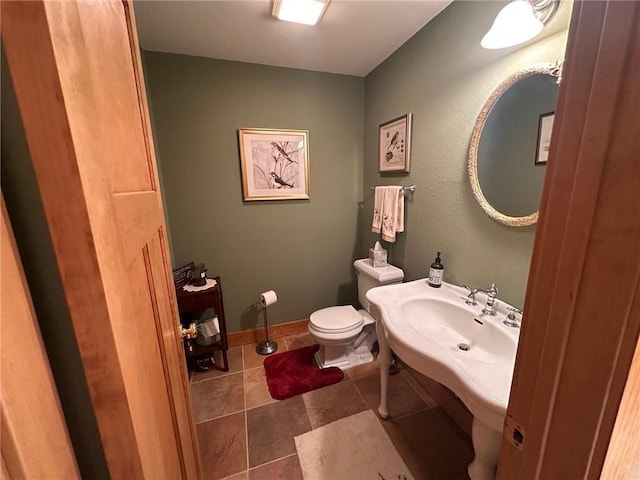 W735 County Road D, Birchwood, WI 54817 - bathroom featuring toilet, tile patterned floors, and baseboards