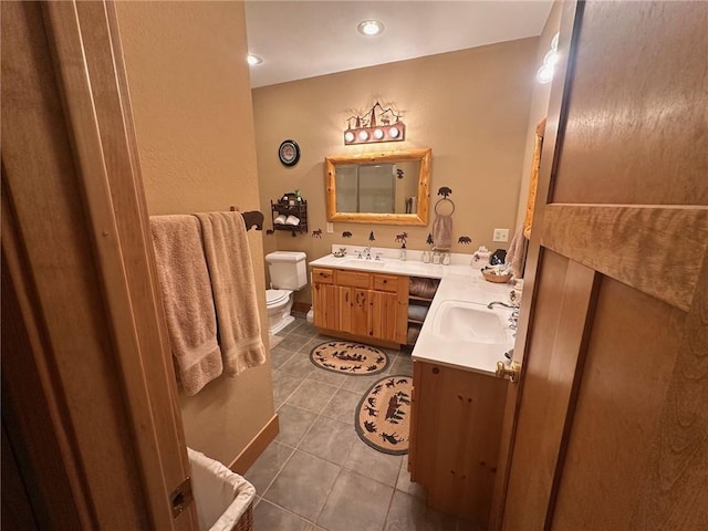W735 County Road D, Birchwood, WI 54817 - bathroom featuring tile patterned flooring, double vanity, and toilet