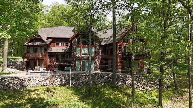 W735 County Road D, Birchwood, WI 54817 - back of house featuring stairs, a wooden deck, a patio, and log siding