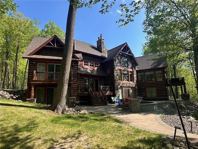 W735 County Road D, Birchwood, WI 54817 - back of house with a patio, stairs, a chimney, and a deck