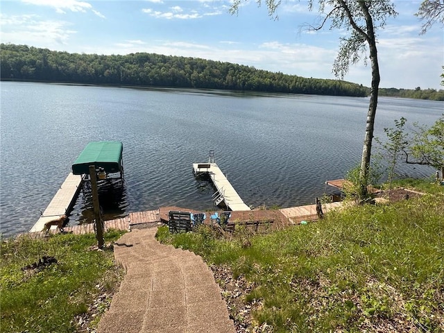 W735 County Road D, Birchwood, WI 54817 - dock featuring a water view and a wooded view