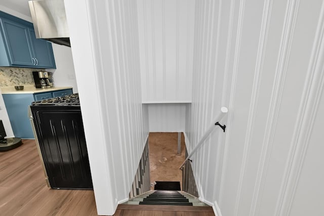stairs with wood finished floors