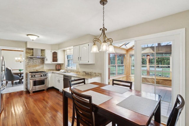 1714 Lewon Dr, Madison, WI 53711 - dining area featuring a chandelier and dark wood-type flooring