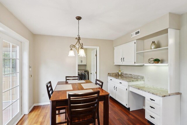 1714 Lewon Dr, Madison, WI 53711 - dining room with washer / dryer, dark wood-style floors, and baseboards