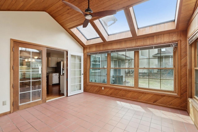 1714 Lewon Dr, Madison, WI 53711 - unfurnished sunroom with a skylight, wooden walls, healthy amount of natural light, tile patterned flooring, and baseboards