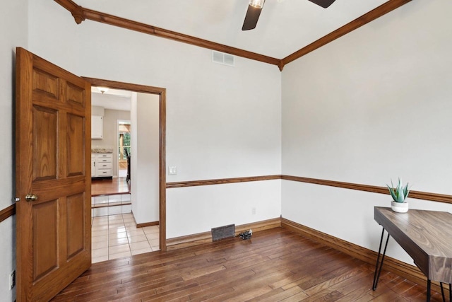 1714 Lewon Dr, Madison, WI 53711 - unfurnished room with a ceiling fan, crown molding, light wood-style floors, and baseboards