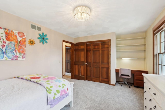 1714 Lewon Dr, Madison, WI 53711 - bedroom with light colored carpet, a chandelier, and a closet