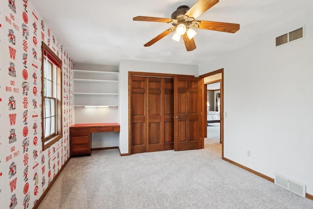 1714 Lewon Dr, Madison, WI 53711 - unfurnished bedroom with baseboards, carpet flooring, a closet, and a ceiling fan