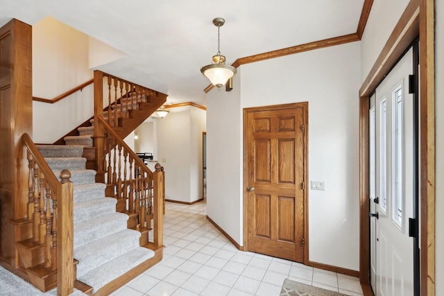 1714 Lewon Dr, Madison, WI 53711 - entrance foyer featuring baseboards, stairs, light tile patterned floors, healthy amount of natural light, and ornamental molding