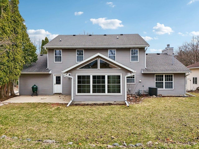 1714 Lewon Dr, Madison, WI 53711 - rear view of property with a patio, a lawn, central AC unit, and a chimney