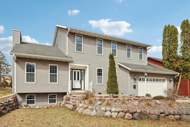 1714 Lewon Dr, Madison, WI 53711 - view of front of property featuring a garage, a chimney, and driveway