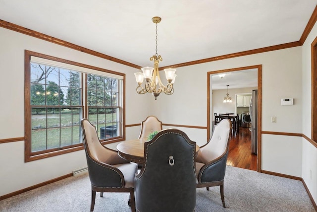 1714 Lewon Dr, Madison, WI 53711 - dining space featuring a chandelier, baseboards, crown molding, and carpet