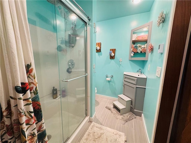 E6355 County Road D Dr, Colfax, WI 54730 - bathroom with a stall shower, baseboards, and vanity