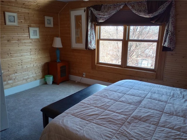 109 3rd St, Black River Falls, WI 54615 - carpeted bedroom featuring wooden walls and baseboards