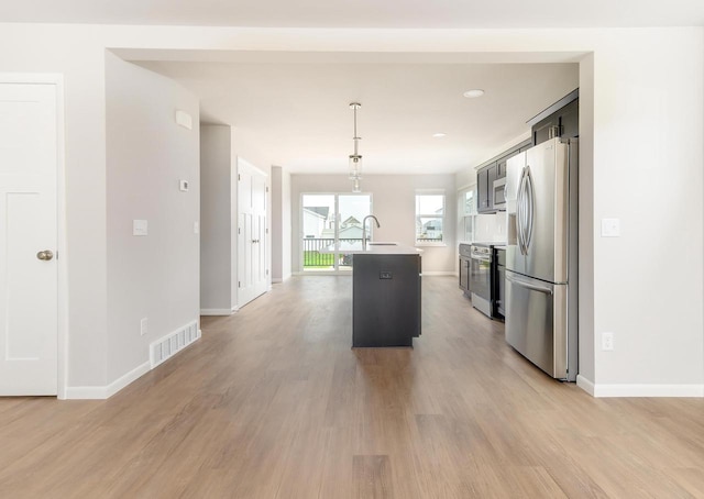 9120 Valley View Rd, Verona, WI 53593 - kitchen with appliances with stainless steel finishes, light wood-style flooring, and light countertops