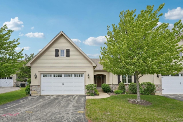 2140 Prairie View Pt, Lake Geneva, WI 53147 - view of front of property with stone siding, stucco siding, and asphalt driveway