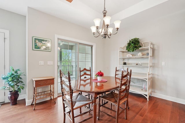 2140 Prairie View Pt, Lake Geneva, WI 53147 - dining space featuring a chandelier, wood finished floors, and baseboards