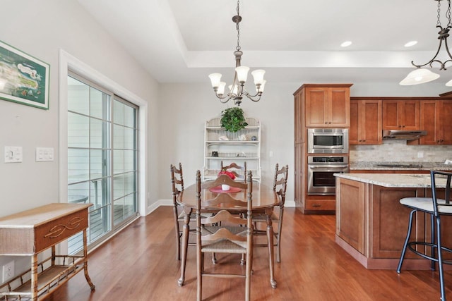 2140 Prairie View Pt, Lake Geneva, WI 53147 - dining room featuring a chandelier, wood finished floors, baseboards, and recessed lighting