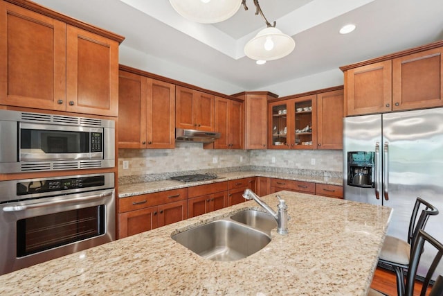 2140 Prairie View Pt, Lake Geneva, WI 53147 - kitchen featuring appliances with stainless steel finishes, a sink, brown cabinets, glass insert cabinets, and recessed lighting