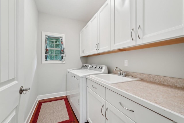 2140 Prairie View Pt, Lake Geneva, WI 53147 - clothes washing area featuring washing machine and dryer, cabinet space, and baseboards