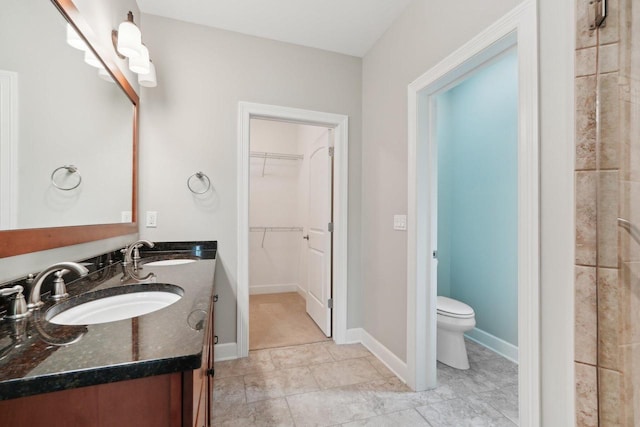 2140 Prairie View Pt, Lake Geneva, WI 53147 - full bathroom featuring toilet, a spacious closet, and double vanity