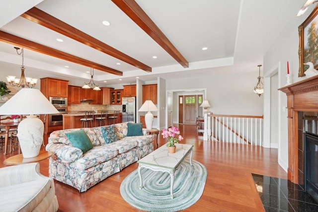 2140 Prairie View Pt, Lake Geneva, WI 53147 - living area with a chandelier, beam ceiling, a fireplace with flush hearth, baseboards, and recessed lighting