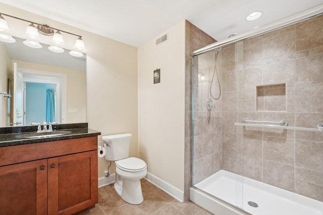 2140 Prairie View Pt, Lake Geneva, WI 53147 - bathroom with a shower stall, baseboards, toilet, vanity, and tile patterned flooring