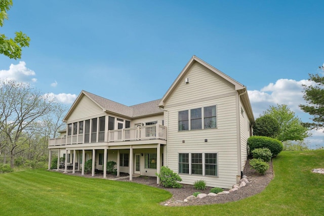 2140 Prairie View Pt, Lake Geneva, WI 53147 - rear view of property featuring a sunroom, a yard, and a wooden deck