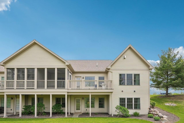 2140 Prairie View Pt, Lake Geneva, WI 53147 - rear view of house with a sunroom, a yard, and roof with shingles
