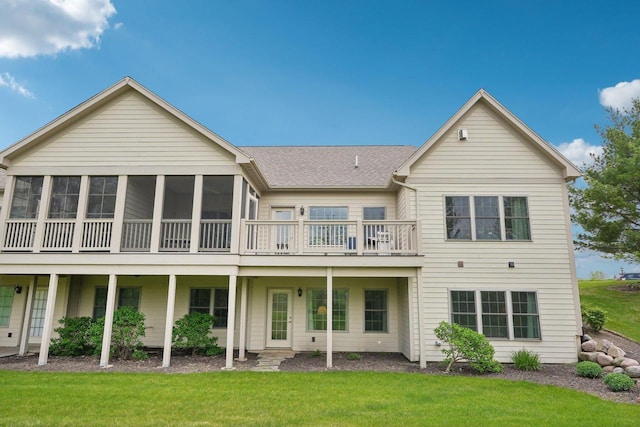 2140 Prairie View Pt, Lake Geneva, WI 53147 - back of house featuring a yard, a sunroom, and roof with shingles