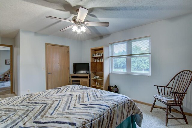 13037 40th Ave Ave, Chippewa Falls, WI 54729 - bedroom with carpet, baseboards, a textured ceiling, and a ceiling fan