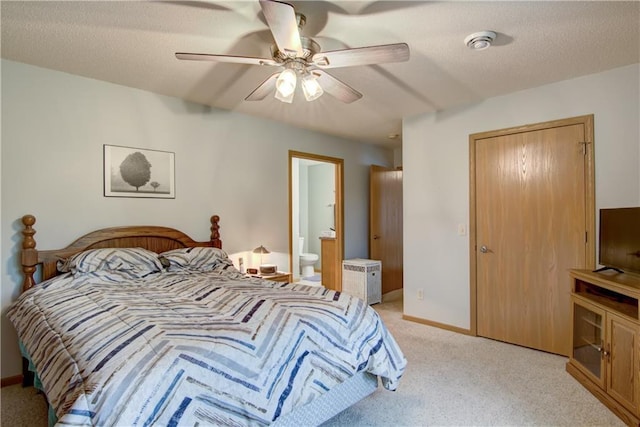 13037 40th Ave Ave, Chippewa Falls, WI 54729 - bedroom featuring light colored carpet, connected bathroom, ceiling fan, baseboards, and a textured ceiling