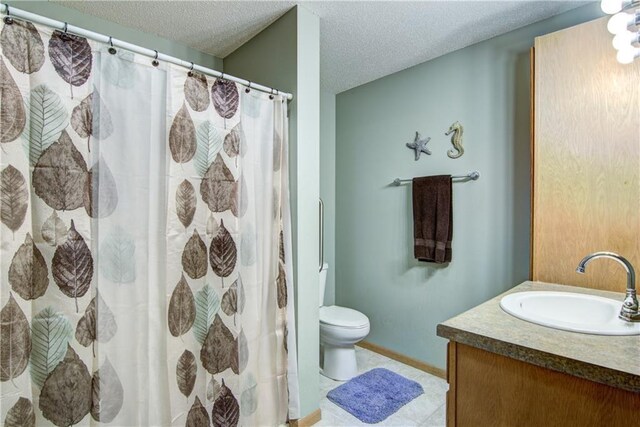 13037 40th Ave Ave, Chippewa Falls, WI 54729 - bathroom with vanity, toilet, a textured ceiling, curtained shower, and baseboards