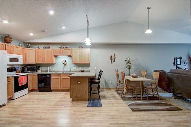 13037 40th Ave Ave, Chippewa Falls, WI 54729 - kitchen with white appliances, lofted ceiling, light wood-style floors, light countertops, and light brown cabinetry