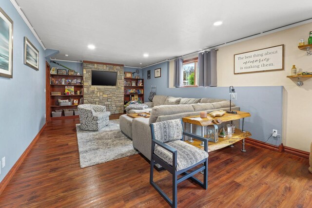 W5412 Bowe Ln, Fond Du Lac, WI 54937 - living room with ornamental molding, wood finished floors, baseboards, a stone fireplace, and recessed lighting