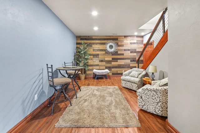 W5412 Bowe Ln, Fond Du Lac, WI 54937 - living area with wood walls, stairway, wood finished floors, baseboards, and recessed lighting