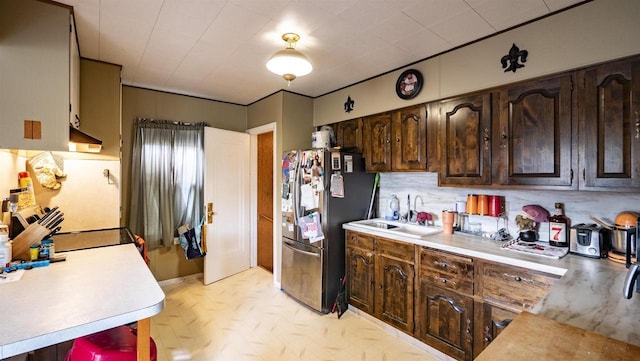 207 E Sumner St, Weyauwega, WI 54983 - kitchen with freestanding refrigerator, a sink, light countertops, extractor fan, and backsplash
