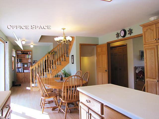 1060 Kamla Ct, Platteville, WI 53818 - dining space with light wood-type flooring, stairway, and a chandelier
