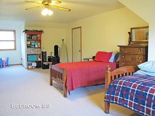 1060 Kamla Ct, Platteville, WI 53818 - carpeted bedroom with a ceiling fan