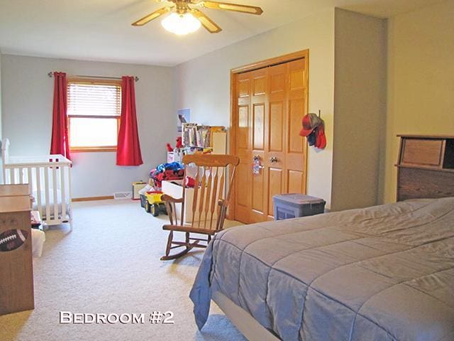 1060 Kamla Ct, Platteville, WI 53818 - bedroom with carpet, a ceiling fan, and baseboards