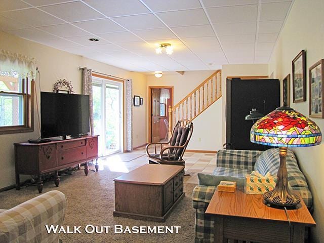 1060 Kamla Ct, Platteville, WI 53818 - living room with stairs, a drop ceiling, and carpet floors