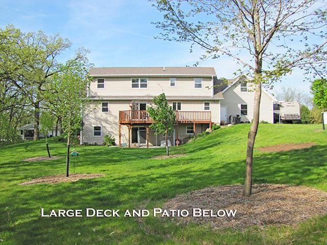 1060 Kamla Ct, Platteville, WI 53818 - back of house with a wooden deck and a lawn